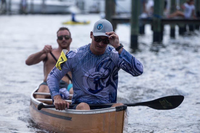 Adam Mortellaro, front, and his brother Anthony Mortellaro of Naples finish the Ambitious Amateur race, Saturday, May 11, 2019, during the 43rd annual Great Dock Canoe Race at Crayton Cove in Naples.