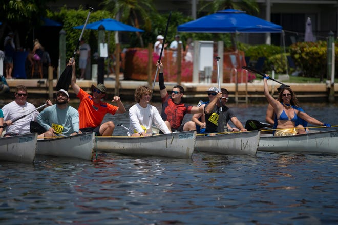 Ambitious Amateurs canoe race participants get ready for their race, Saturday, May 11, 2019, during the 43rd annual Great Dock Canoe Race at Crayton Cove in Naples.