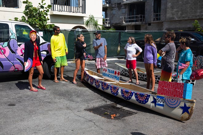 Participants prepare for the Theme Canoe Parade at the 43rd annual Great Dock Canoe Race in Naples on Saturday, May 11, 2019.