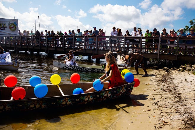 Participants get in their canoes for the Theme Canoe Parade at the 43rd annual Great Dock Canoe Race in Naples on Saturday, May 11, 2019. The theme this year was "Heroes and Villains."