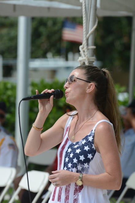 Mary Jo O'Regen sings "America the Beautiful." Marco Island commemorated Memorial Day on Monday morning with a ceremony at Veterans' CommunityPark, with a keynote address by American Legion Post #404 Commander Lee Rubenstein.