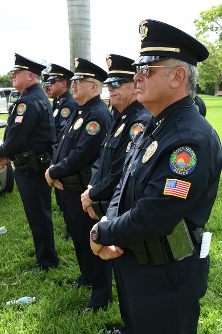 Police Chief Al Schettino and officers. Marco Island commemorated Memorial Day on Monday morning with a ceremony at Veterans' CommunityPark, with a keynote address by American Legion Post #404 Commander Lee Rubenstein.
