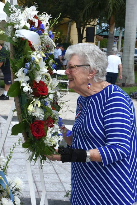 Emily Savage smells the roses. Marco Island commemorated Memorial Day on Monday morning with a ceremony at Veterans' CommunityPark, with a keynote address by American Legion Post #404 Commander Lee Rubenstein.