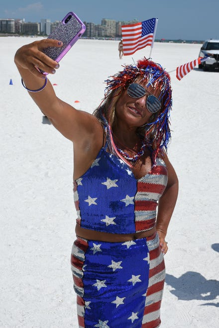 JoAnn Leondardi garbs herself in stars and stripes. Marco Island's Fourth of July was a day at the beach, with activities, splashing and thousands thronging the shore for Uncle Sam's Sand Jam.