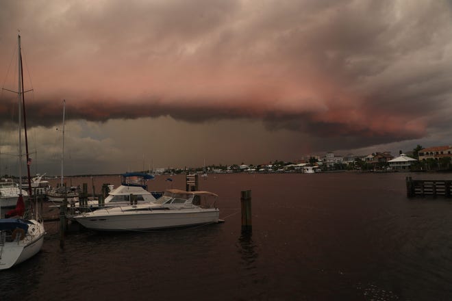 A line of thunderstorms is lit by the setting sun over Mantanzas Pass on Saturday, August 24, 2019. Recent storms have lit up the skies of Southwest Florida from sunsets to lightning.