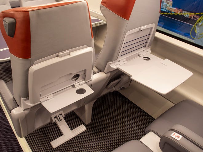 Each seat back is equipped with dual tray tables so customers have a large and small table option.