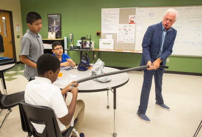 Robert Benya pulls a foam pipe with students during a robotics class at Cypress Palm Middle School on Thursday, Aug. 29, 2019. Benya was CEO of Time Warner In Demand. Now, he has a second career as a teacher at Cypress Palm.