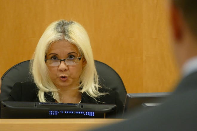 Code Enforcement special magistrate Myrnabelle Roche speaks to the legal representative of Madeira on Marco Island condominium association on Sept. 24, 2019.