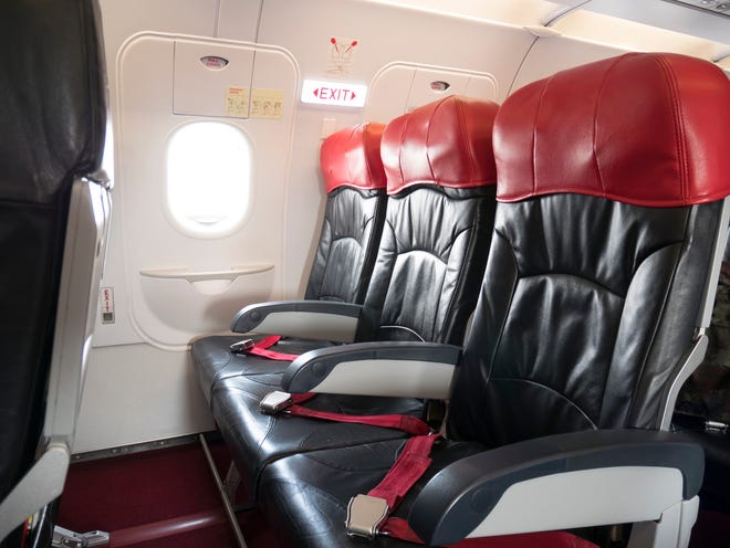 Research premium economy seats. You might want to get extra legroom by booking the emergency row, but be aware that armrests in these rows cannot be raised. Purchasing a premium economy seat might do the trick.
