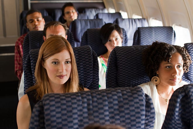 Be extra kind to your seatmates. Your row might be a bit snugger than some others on your flight. And it ’ s hard to endure a huffy seatmate who resents your very existence. Smile, say hello and introduce yourself to your fellow passengers. It ’ s tougher to be nasty to you if you ’ re sweet as pie.