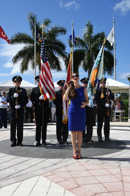 Mary Jo O'Regan sings the National Anthem. Marco Island commemorated Veterans' Day on Monday, with a ceremony at 11 a.m. in Veterans' Community Park.