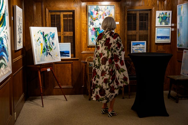 Community members enjoy various art work during the "Five Faces of Fakahatchee" gala, Thursday, Jan. 16, 2020, at the Arsenault Studio & Banyan Arts Gallery in Naples.