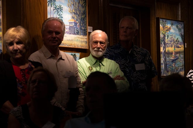 Tom Maish, chairman of BoardWalk Vision Committee, Friends of Fakahatchee, third from left, Wednesday, Jan. 16, 2020, at the Arsenault Studio & Banyan Arts Gallery in Naples.
