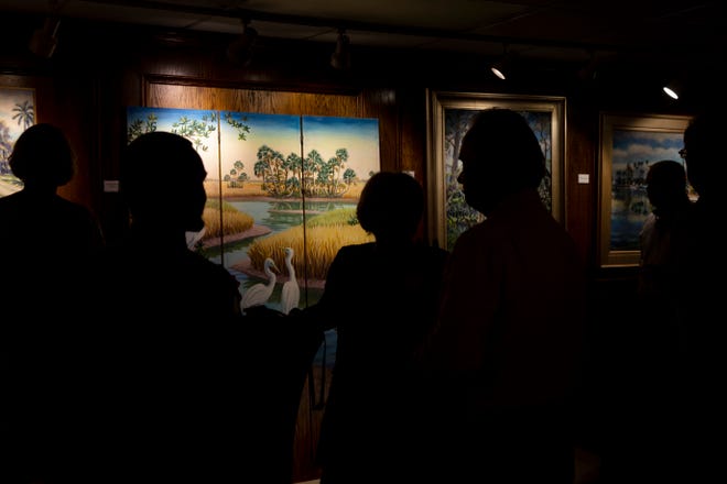 Community members mingle and enjoy art work during the "Five Faces of Fakahatchee" gala, Thursday, Jan. 16, 2020, at the Arsenault Studio & Banyan Arts Gallery in Naples.
