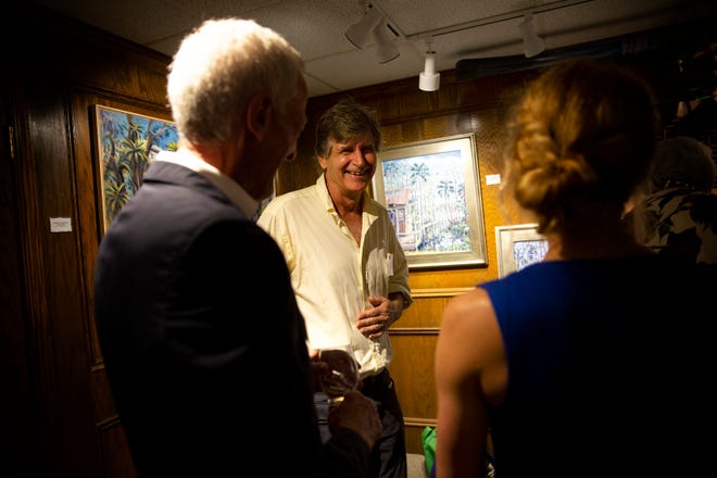 Naples artist Paul Arsenault talks with guests during the "Five Faces of Fakahatchee" gala, Wednesday, Jan. 16, 2020, at the Arsenault Studio & Banyan Arts Gallery in Naples.