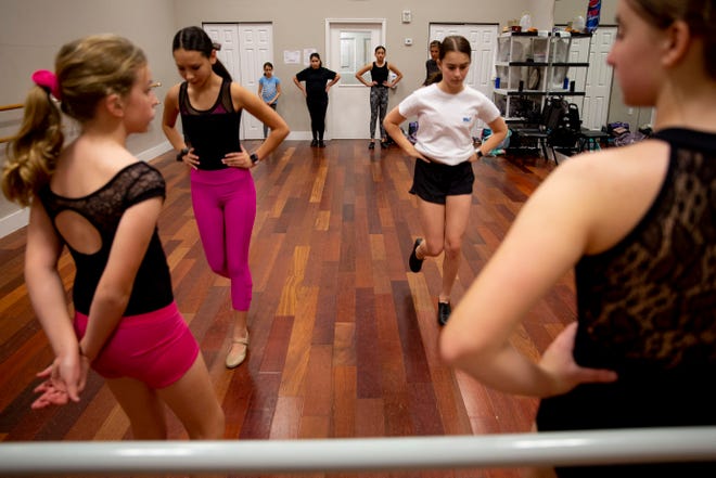 Students practice a step in pairs during a tap class at Naples Performing Arts Center on Friday, January 24, 2020.