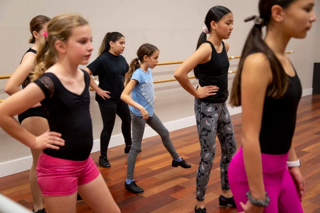 From left to right, Olivia Lanzafane, 13, Julianne Arthur, 11, Sarah Azzopardi, 12, Rafaela Kut, 9, Naomi Luu, 12, and Blythe Hart, 13, practice a step during a tap class at Naples Performing Arts Center on Friday, January 24, 2020.