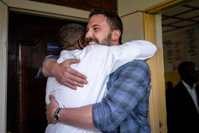 Talk about a warm welcome! Affleck is hugged by 2018 Nobel Peace Prize laureate Denis Mukwege upon arriving at the Panzi hospital in the Democratic Republic of the Congo, ahead of a meeting on Dec. 29, 2018.