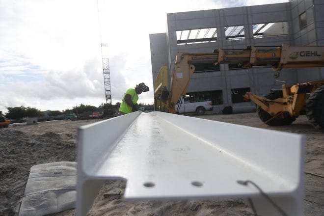 Work progresses on the new FineMark Bank headquarters in south Fort Myers. It was recently topped off with its last steel beam. Construction is ahead of schedule.