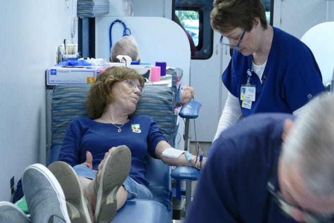 Marco Island resident Lil Bardon donates blood in the Community Blood Center mobile unit at Marco Healthcare Center on March 5, 2020.