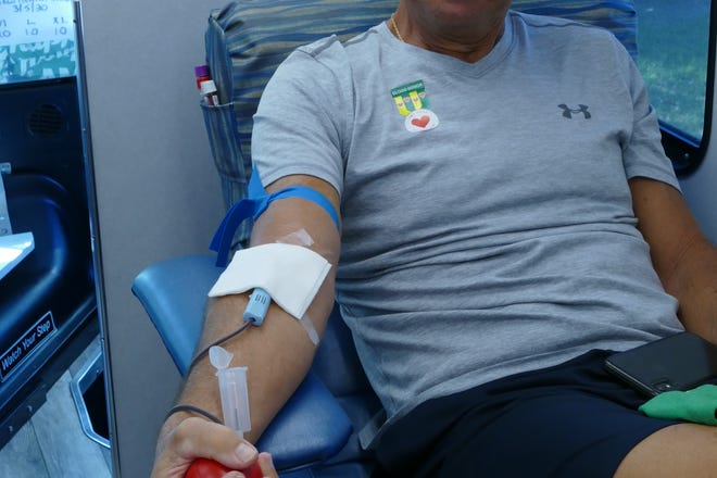 Marco Island resident Francis E. Sanz donates blood in the Community Blood Center mobile unit at Marco Healthcare Center on March 5, 2020.