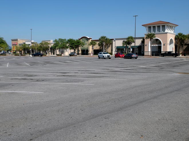 In a rare sight, the parking lot of Cordova Mall is all but empty as Escambia county comes to grips with the COVID-19 outbreak on Thursday, March 26, 2020.