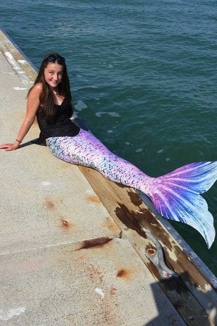 Summer shows off her mermaid getup. Summer Joy Hill, 16, has been donning her mermaid tail and waving to passing boats to cheer people up during the coronavirus pandemic.