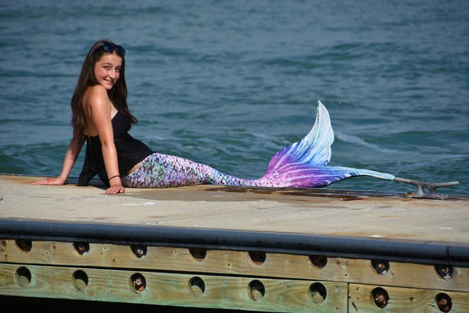 Summer shows off her mermaid getup. Summer Joy Hill, 16, has been donning her mermaid tail and waving to passing boats to cheer people up during the coronavirus pandemic.