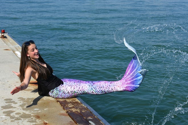 Making a splash Ð Summer makes waves with her fins. Summer Joy Hill, 16, has been donning her mermaid tail and waving to passing boats to cheer people up during the coronavirus pandemic.