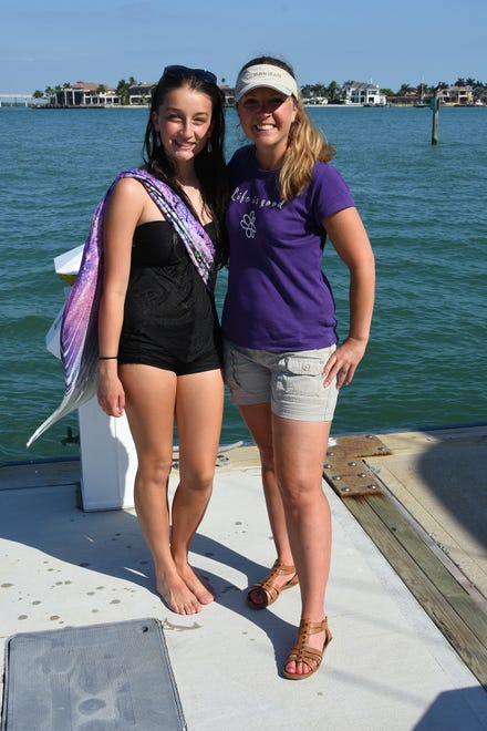 Summer and her mother Colleen Hill. Summer Joy Hill, 16, has been donning her mermaid tail and waving to passing boats to cheer people up during the coronavirus pandemic.