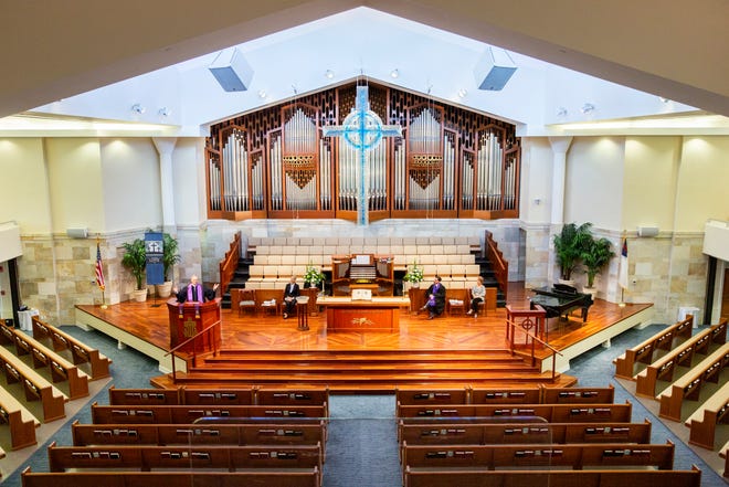 Senior Pastor Craig Goodrich leads a church service in front of rows of empty pews at First Presbyterian Church in Naples on Saturday, March 14, 2020. The church will be filming services for members of the congregation to watch online in an effort to limit social contact and slow the spread of COVID-19.