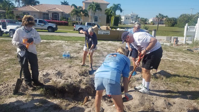 Staff and volunteers from Audubon Western Everglades dig in search of burrowing owl eggs or chicks following a the collapse of two owl burrows on 1631 Collingswood Court, Marco Island on May 8, 2020.