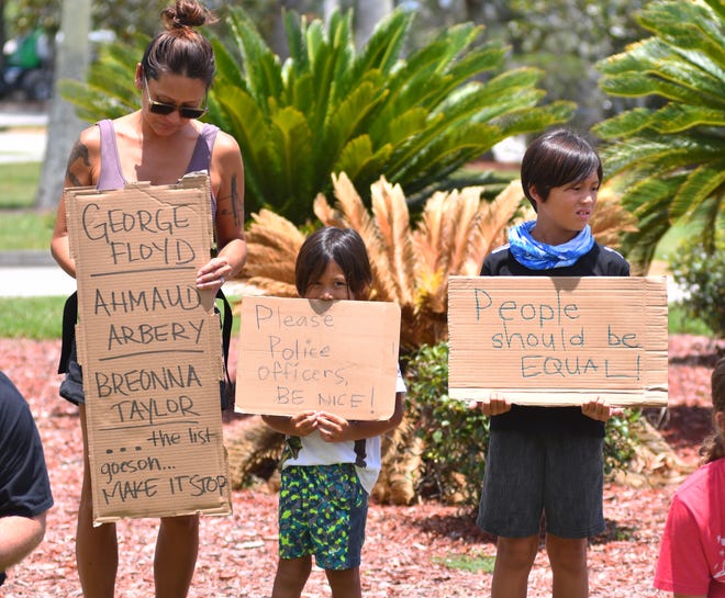 Jamie Melnicove and her two children Von and Max hold signs during the 10 minutes of silence. Jarvis James of Melbourne does not consider himself an activist, but wanted to do something peaceful about all the violence going on in cities over the death of George Floyd. He put a post on Facebook inviting people to come to the Moore Justice Center in Viera and take a knee for 10 minutes. No speeches, no bullhorns, just a non-violent 10 minute take a knee. At the end, some read quotes about racism off their phones or signs.
