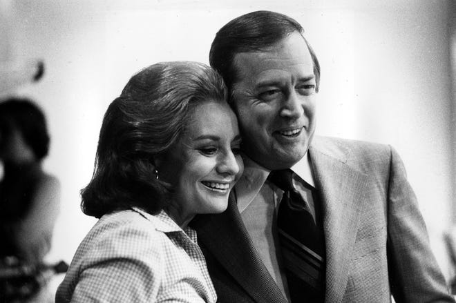 Barbara Walters and Hugh Downs hug during the airing of Walters' final live broadcast as co-host of morning news program the "Today" show at the NBC studios in New York City on June 3, 1976.