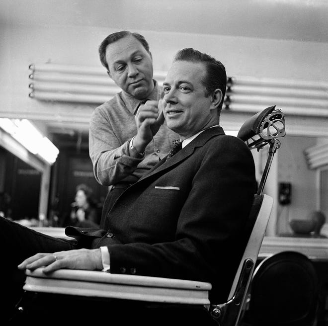 Hugh Downs gets finishing touches of makeup in the National Broadcasting Company Studio in New York’s Rockefeller Center on Feb. 15, 1960.