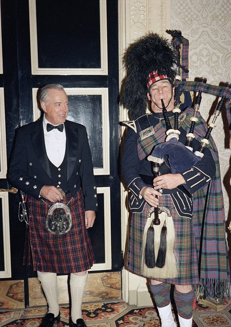Hugh Downs is serenaded by bagpiper Charlie Kron at the 1987 Scottish Ball in New York on Oct. 16, 1987.