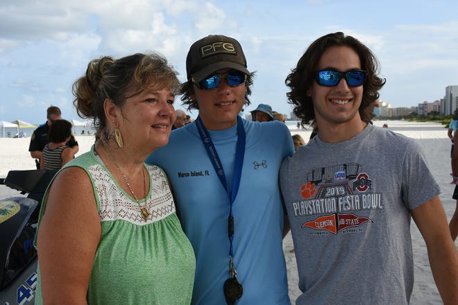 Lisa Smith, Clayton's widow, with sons Clayton J. Smith, 20, and Zachary, 18, two of the couple's seven children. Dozens of police officers and supporters gathered at South Beach on Sunday morning to commemorate a memorial bench in honor of the late MIPD Lt. Clayton Smith.