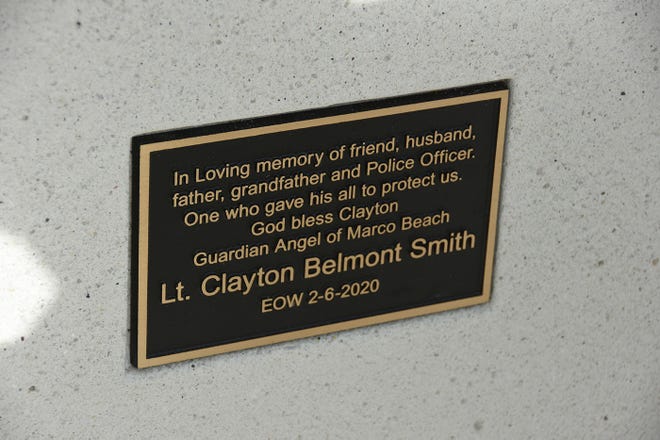 The plaque on the back of the memorial bench. Dozens of police officers and supporters gathered at South Beach on Sunday morning to commemorate a memorial bench in honor of the late MIPD Lt. Clayton Smith.