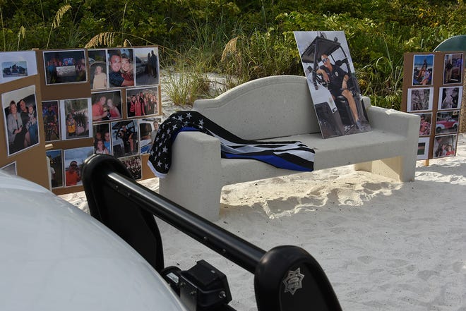 Clayton's bench surrounded with memorabilia. Dozens of police officers and supporters gathered at South Beach on Sunday morning to commemorate a memorial bench in honor of the late MIPD Lt. Clayton Smith.