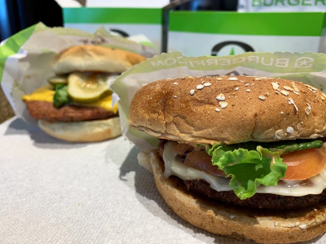 Foreground: The “VegeFi” burger; background: the Beyond burger from BurgerFi, South Naples.