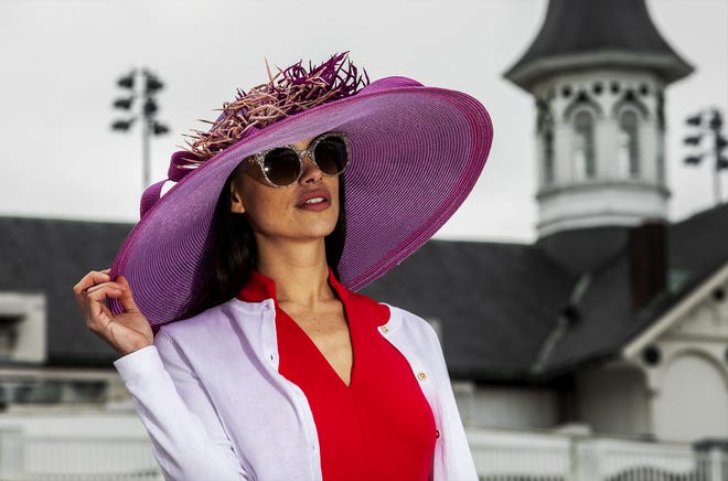 Kristina Russ models a fuchsia and pink Frank Olive straw hat during a Kentucky Derby fashion shoot with stylist Jo Ross at Churchill Downs. March 11, 2020