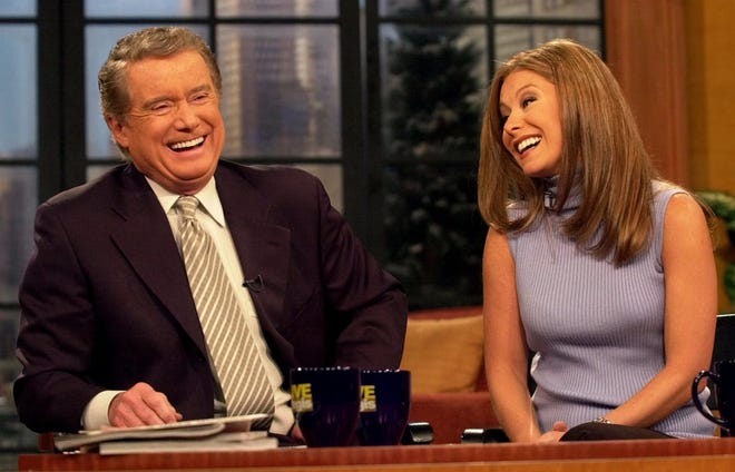 Regis Philbin shares a laugh with new co-host Kelly Ripa during a broadcast of "Live! With Regis and Kelly" on Feb. 5, 2001, in New York. Ripa, who is known for her role on ABC soap opera "All My Children," replaced Kathie Lee Gifford, who left the show in July 2000.