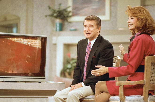Regis Philbin and Kathie Lee Gifford react during a WABC-TV broadcast of "Live! With Regis and Kathie Lee" on Sept. 8, 1988, in New York.