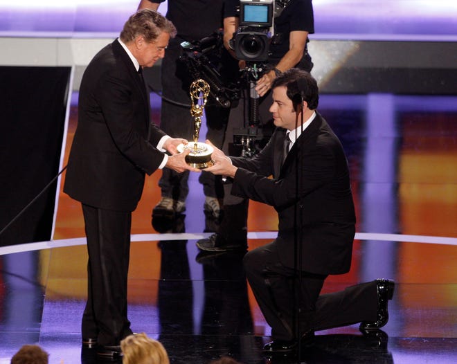 Regis Philbin, left, is presented with a lifetime achievement award by Jimmy Kimmel at the 35th annual Daytime Emmy Awards in Los Angeles on June 20, 2008.