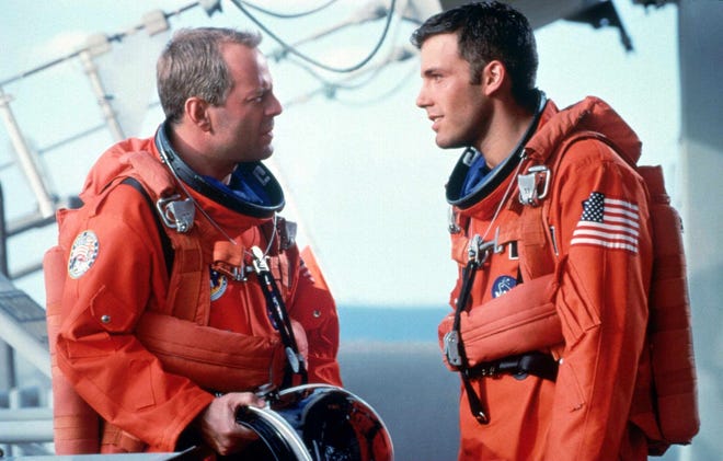 Training to shuttle into space to plant nuclear explosives in an asteroid that threatens to destroy the Earth, A.J. Frost (Affleck) and Harry S. Stamper (Bruce Willis) prepare for the toughest challenge ever faced by mankind in the 1998 sci-fi film “ Armageddon. ”