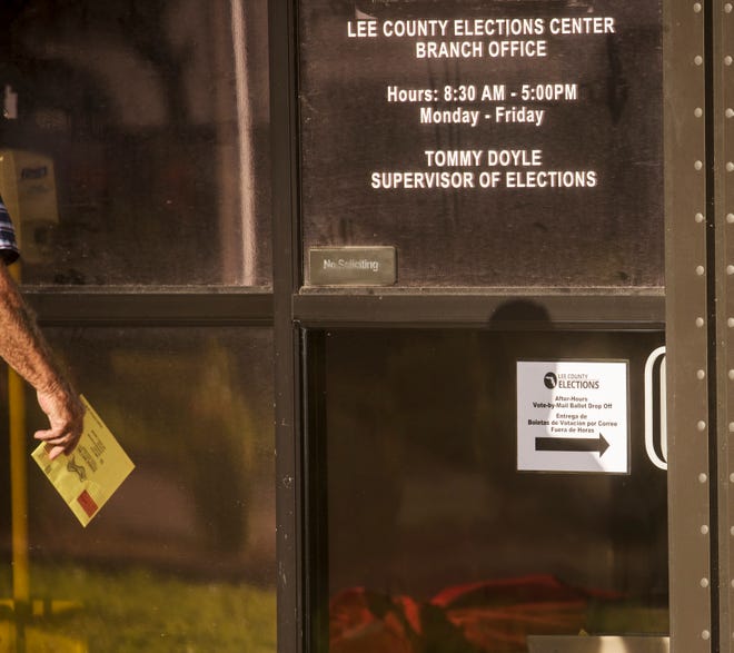 A voter drops off a vote by mail in ballot at the Lee County Elections Center Branch Office on off of U.S. 41 on Tuesday, August 18, 2020. It is primary election day.