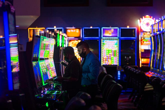 Casino workers prepare machines for guest, Thursday, Aug. 27, 2020, at Seminole Casino Hotel in Immokalee.