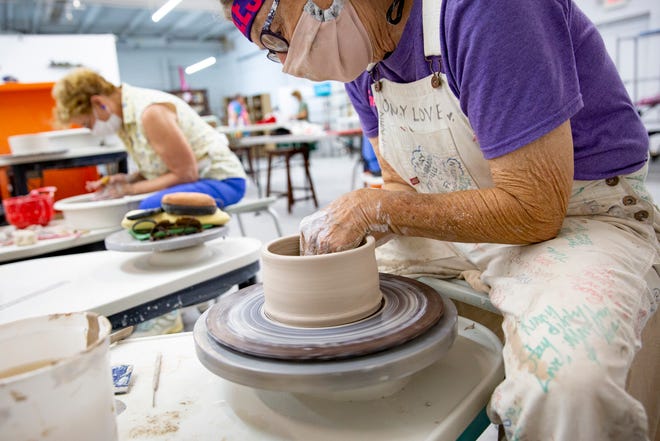 Amy Robinson, left, and Rinny Ryan, right, work on creating a clay music pot at Clay More Ceramics in North Naples on Thursday, August 13, 2020.