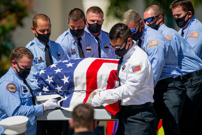 City of Naples Fire Rescue members carry the casket of Naples Firefighter Anthony ÒTonyÓ Christensen to begin his memorial service at Cambier Park in Naples on Saturday, August 8, 2020.