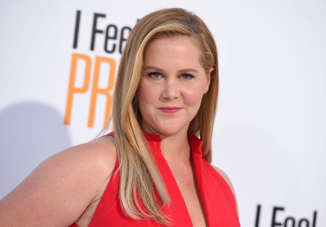 In 2019, Amy Schumer showed love to her postpartum body , posting several Instagram pictures from a beach day with husband Chris Fischer and son. Fans flocked to the comment section, with one follower writing that Schumer ' s " normal woman ' s body " looks " great. " Schumer proudly replied, " I am loving my warm soft post baby body. Grateful to be feeling so strong again!